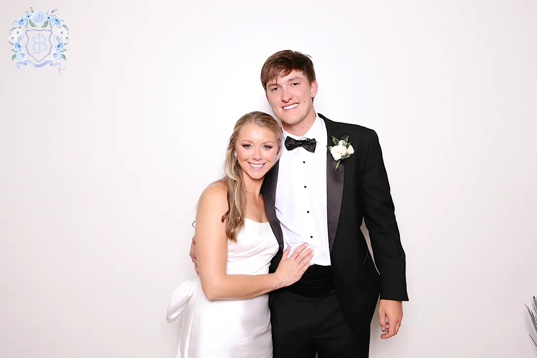 A bride and groom in a Glam Booth portrait under studio lighting.